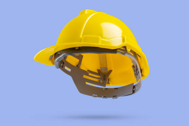 istock Yellow safety construction helmet on blue background 2156837896