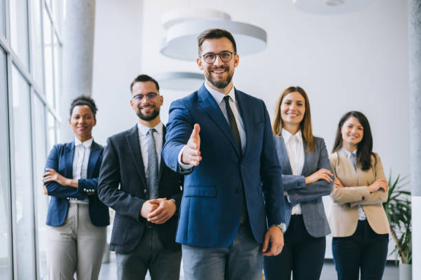 istock Confident business person with colleagues 2156837970