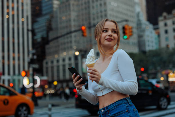 istock Contemplative young woman with ice cream 2156838749