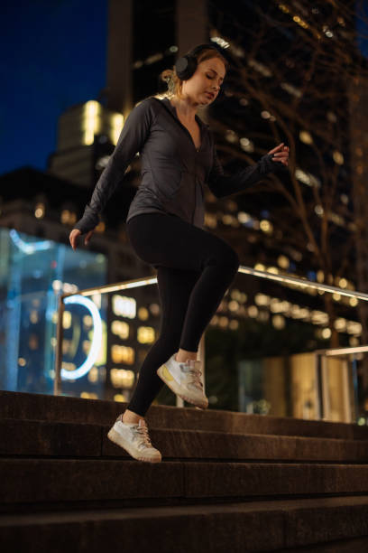 istock Active woman running on city steps 2156838779