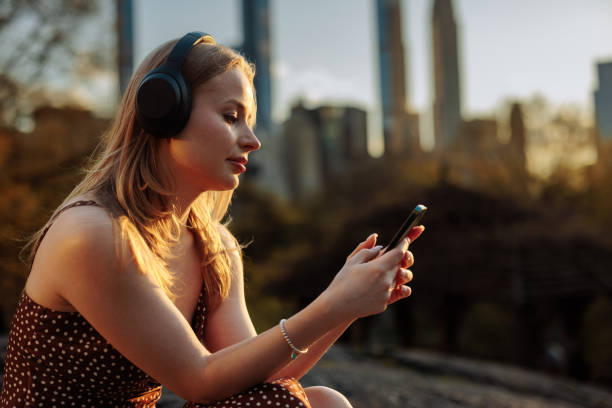 istock Woman using phone with city in the background 2156838787