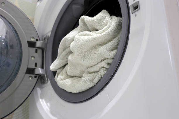 istock Used towel in washing machine 2156839989