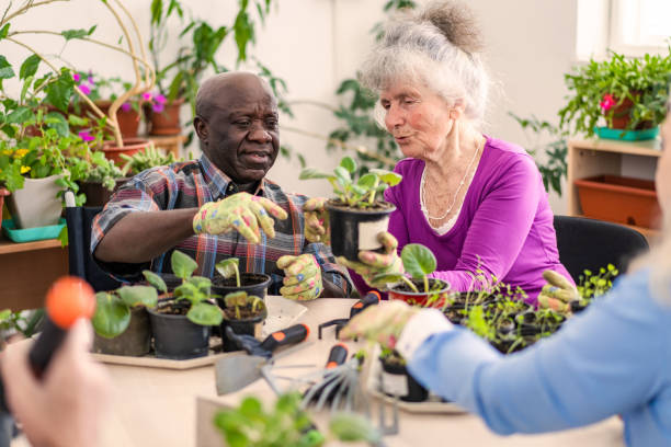 istock Two nursing home residents gardening together 2156840739