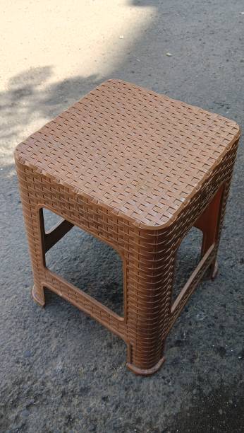 istock brown plastic chairs at a street stall. close up. 2156840998