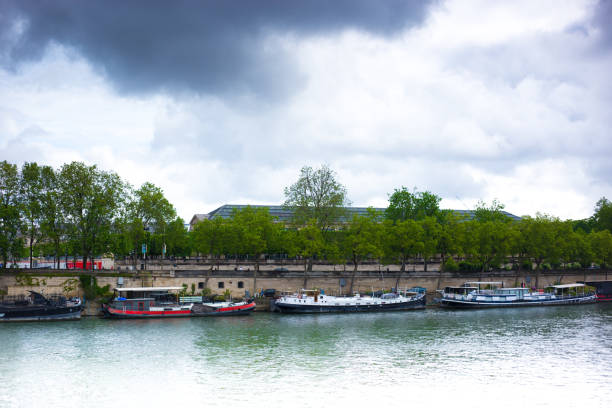 Paris, France: Houseboats on the Seine, Overcast Sky