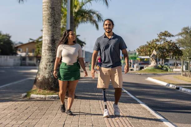 istock Latin couple chatting and walking down the street 2156848230