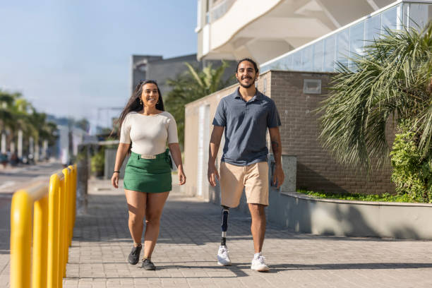 Latin couple chatting and walking down the street