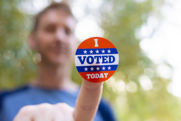 istock Man with an I VOTED sticker 2156848959