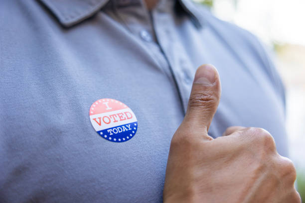 istock Man with an I VOTED sticker 2156848961