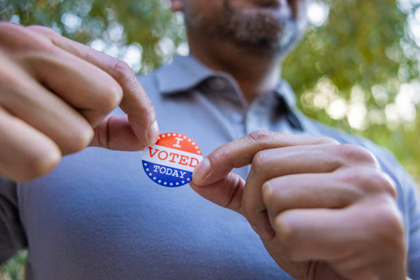 istock Man with an I VOTED sticker 2156848994