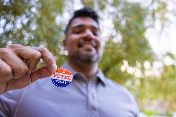 istock Man with an I VOTED sticker 2156849002
