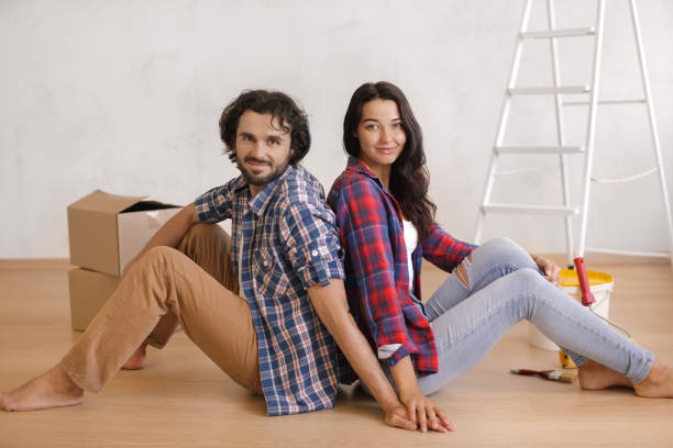 istock Relaxed Couple Resting on Floor During DIY Home Renovation 2156849268
