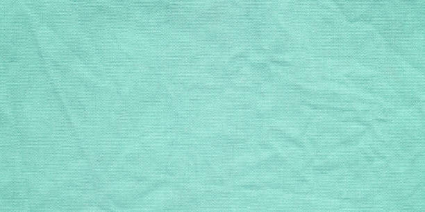 istock Green cotton fabric texture background, Wrinkle surface textile, wallpaper, banner 2156849986