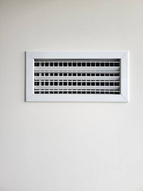 istock Air conditioner grille on a white wall. 2156851489
