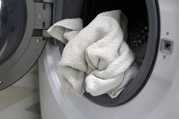 istock Used towel in washing machine 2156851795