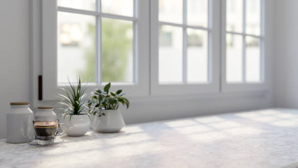 istock A close-up image of a space for displaying products on a white tabletop by the window. 2156853971