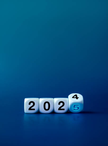istock Loading to new year 2025, business and technology banner background concept. Flipping blocks with 2024 change to glow 2025 year numbers on blue background with copy space, vertical, minimal style. 2156856692