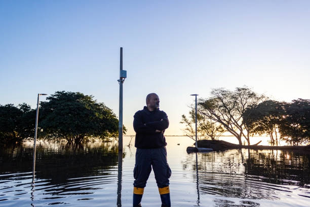 istock Middle-aged black man observing site after flood 2156860594