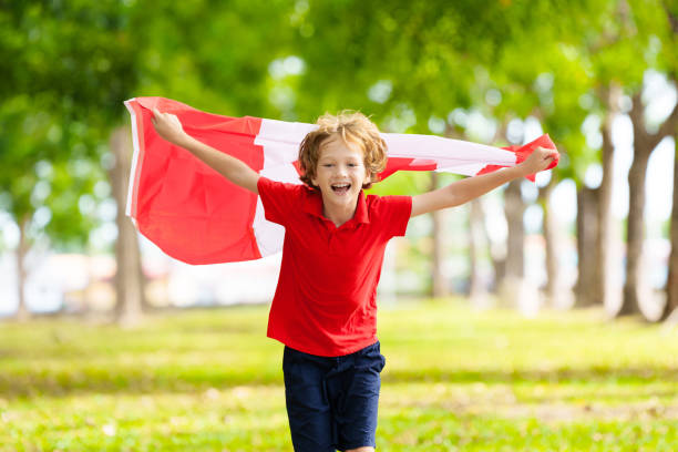 istock Child with Canadian flag. Happy Canada day 2156860609