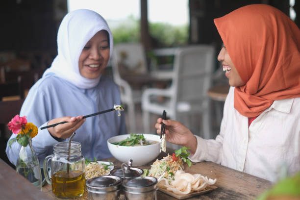 istock Muslim Women Bonding Over Food 2156862786