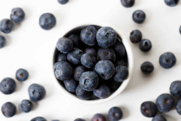 istock Ripe organic blueberries on white wooden table background. Selective focus. 2156864052