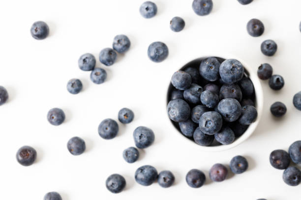 istock Ripe organic blueberries on white wooden table background. Selective focus. 2156864074