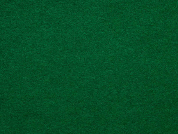 Dark green felt background of suede fabric surface.