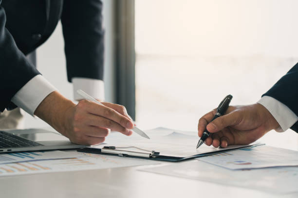 istock Two businessman team calculate about summary report annual on table office. 2156866687