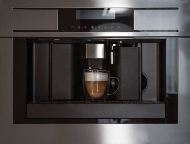 istock Built-in coffee machine making coffee in glass cup, front view 2156868877