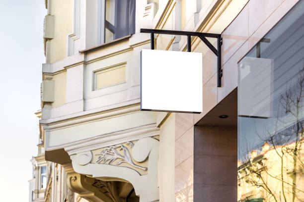 istock Mockup Of Restaurant White Signboard Hanging On The Wall 2156868991