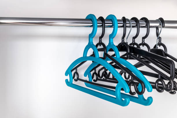 istock Plastic Clothes Hangers Hanging On A Metal Rod 2156869001