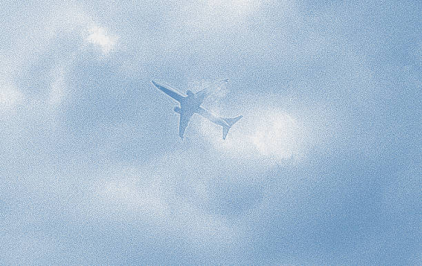 Commercial Airplane flying into clouds