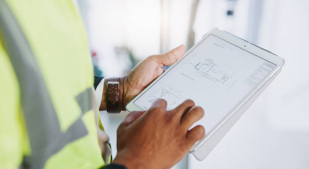 istock Tablet, hands and person with engineer screen while online for planning, blueprints and research. Construction, architecture and industrial mobile app with civil engineering ux for floorplan document 2156870128
