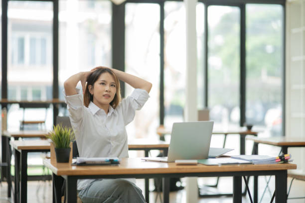 istock businesswoman Sitting and working on graph documents 2156870260