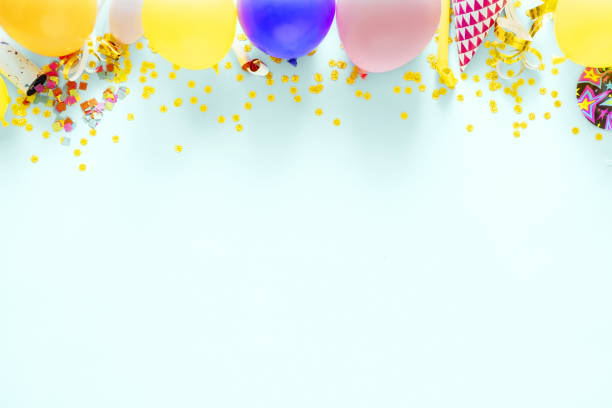 Decoration birthday party on a pastel blue background with copy space top view