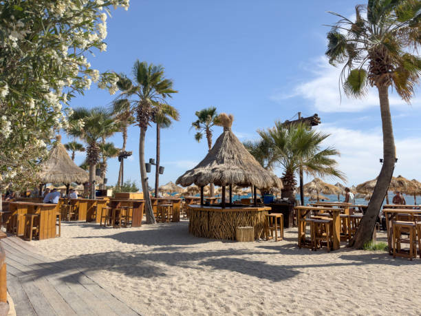Sun loungers, umbrellas and tables on beach
