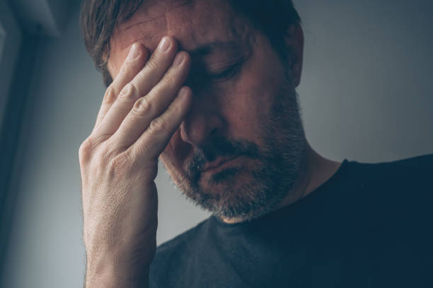 istock Hopeless disappointed man in dark room interior 2156878268