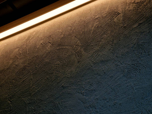istock soffit with a cornice illuminated by LED strips in the arch. walls lined with brown wooden plywood. light cones make a festive impression. a night club with a great reputation and atmosphere, hall 2156878340