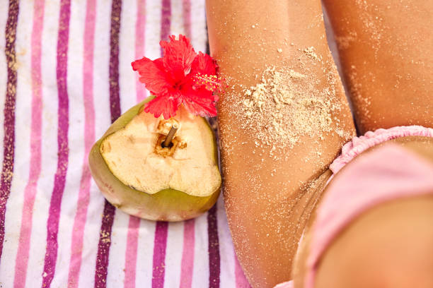 Tropical coconut on golden sand with ocean