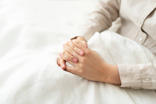 istock Faithful woman praying in bed 2156880091