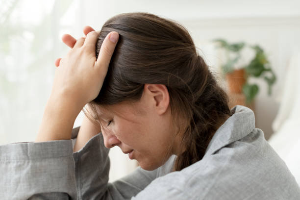 istock Woman suffering from migraine and headache 2156880230
