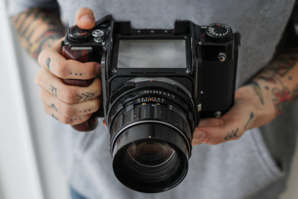 istock Director shooting a film with an analog camera 2156880235