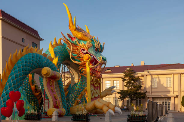 istock Multi-colored figure of a Chinese dragon with a scroll in its mouth 2156880272