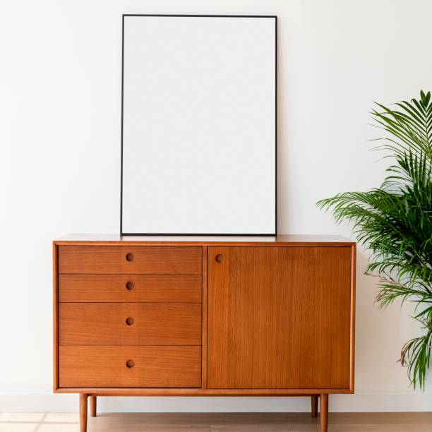istock Blank picture frame on a wooden cabinet 2156881406