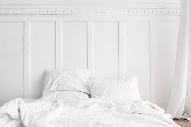 istock White bed linen in a bed in a bedroom 2156881433