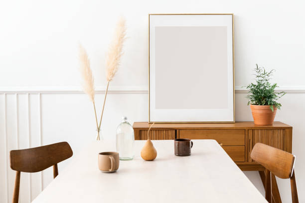 istock Blank large frame on a wooden sideboard in a living room 2156882296