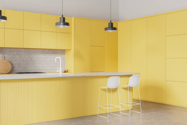 istock Yellow kitchen interior with shelves and countertop, cooking cabinet 2156882355