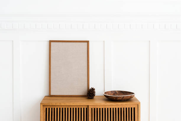 istock Blank large frame on a wooden sideboard in a living room 2156882374