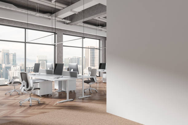 istock White industrial open space office corner with blank wall 2156882497