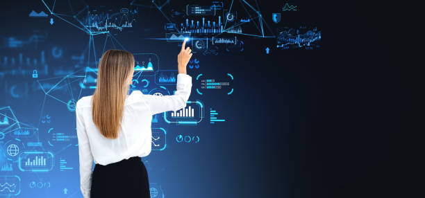 istock Businesswoman finger touch graph chart with research data hologram 2156882618